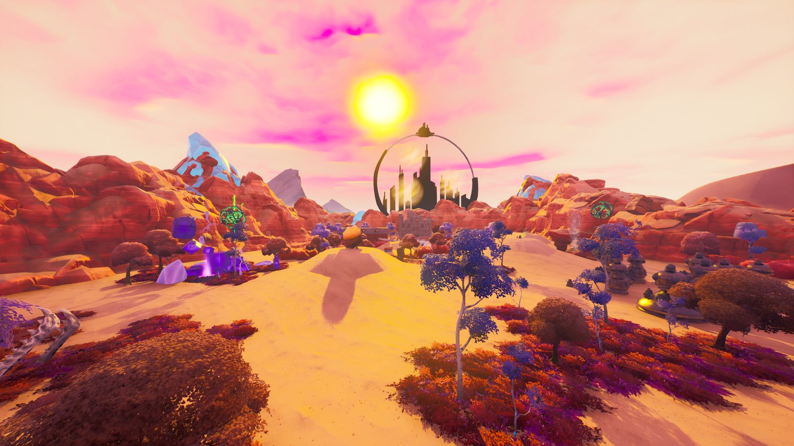 Orange sand and red rock under a pink sky, with the domed citadel silhouetted against the sun